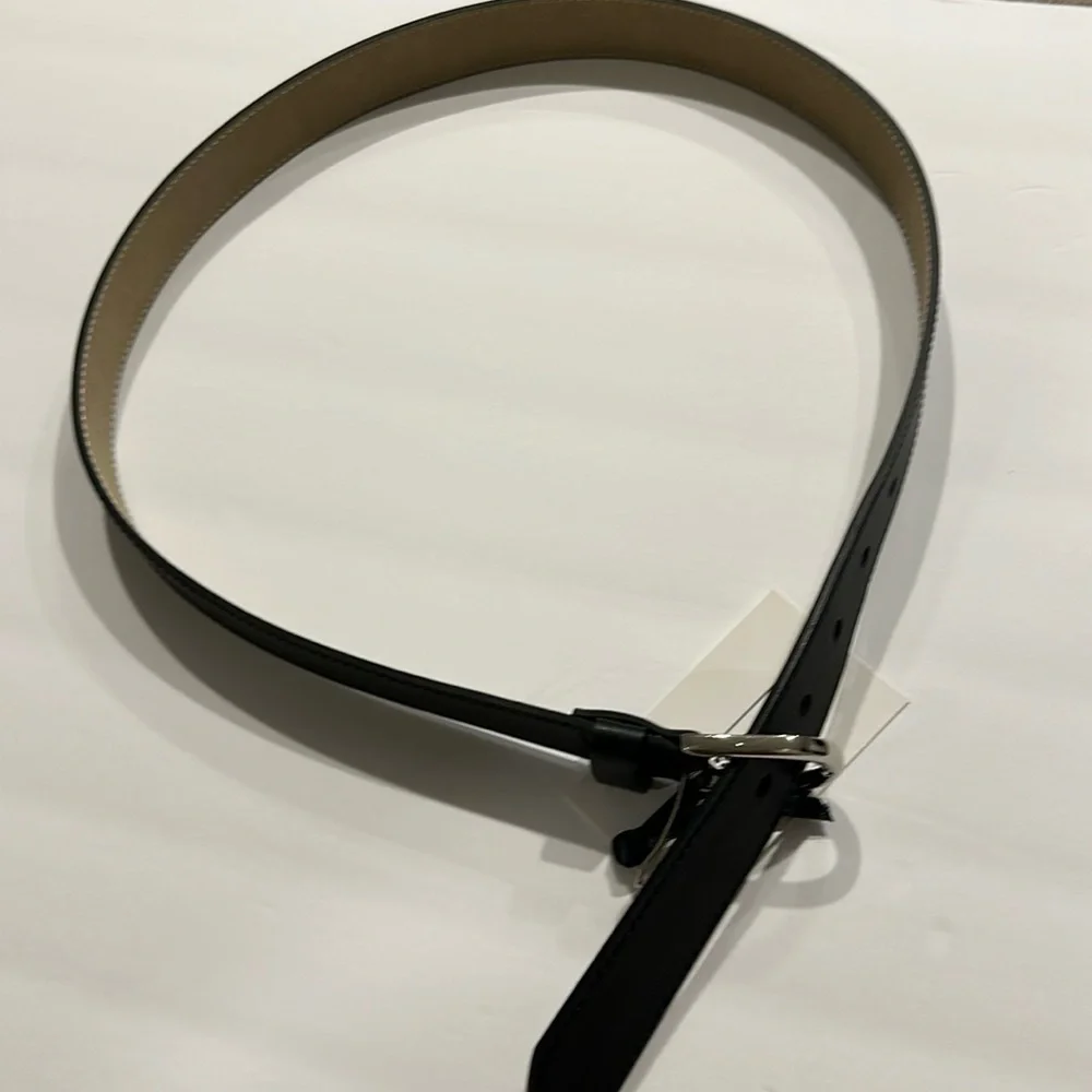 Black Vegan leather belt with silver tone buckle fits approximately 31-36”